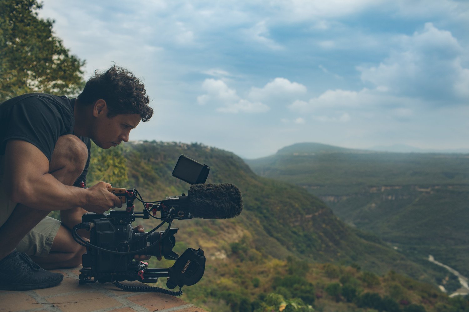 Danny Patterson filming on a mountainside